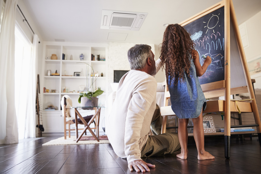 Father and daughter enjoying ductless AC